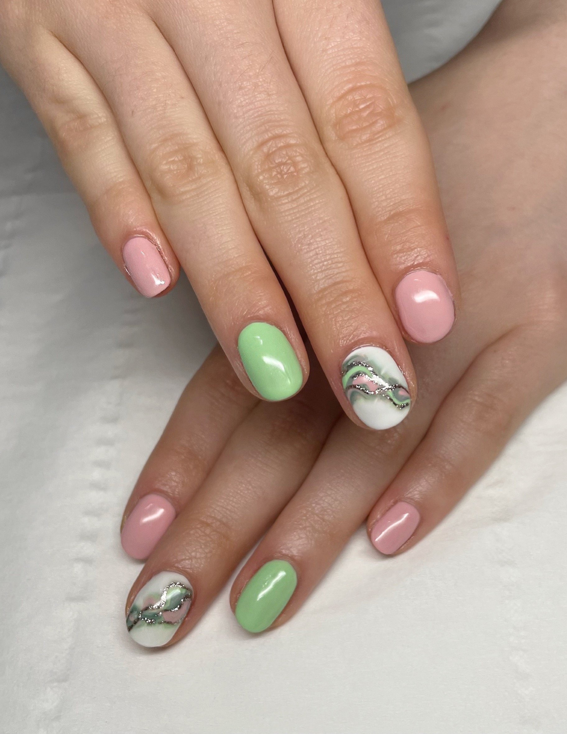 Gel nails in pink and mint with marble nail art